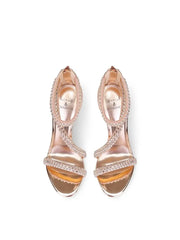 a metal studded sandal with rhinestones and a thin heel.