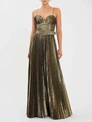 Woman wearing a metallic gold pleated strapless maxi dress.