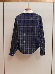 Plaid office shirt layered for autumn street style inspiration