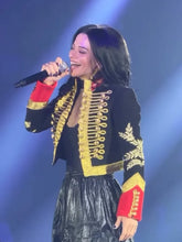 Detail shot highlighting the gold braid-style embroidery and decorative buttons, giving the jacket a polished statement finish