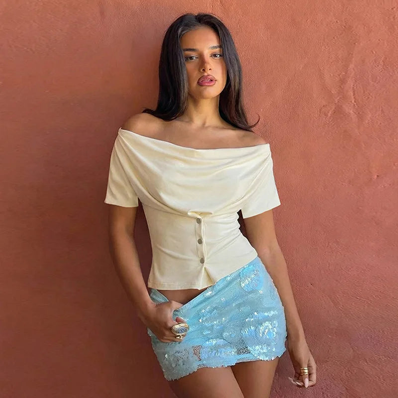 Off-shoulder button-front top styled with dark denim