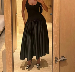 Minimalist ballgown-style dress styled for rooftop dinner