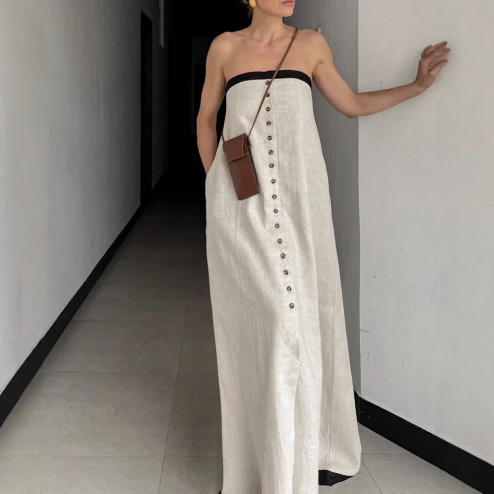 Minimalist strapless linen maxi dress in white with black trim for modern fall styling