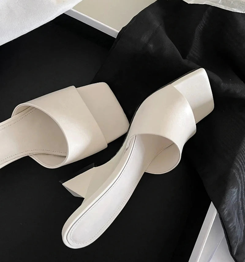 Side view of elegant square toe wedge heel slippers