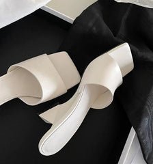 Side view of elegant square toe wedge heel slippers