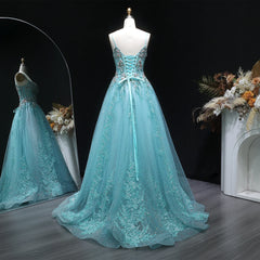 Back view of a backless A-line prom dress with an airy skirt