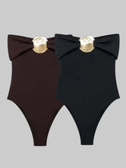 Front view of the slim-fit bodysuit silhouette, highlighting the high-cut leg line and clean, minimalist shape designed for styling with denim.