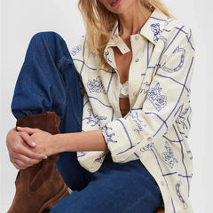 Button-up shirt with blue modern graphic pattern and cropped fit