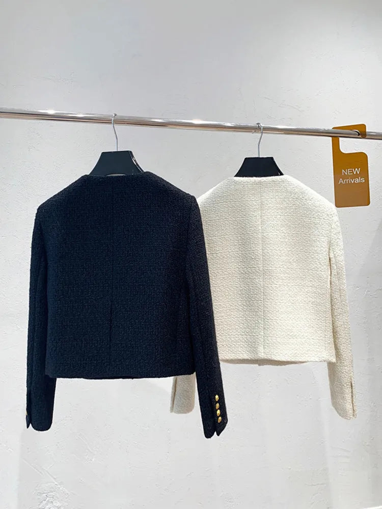 Modern cropped black jacket with classic gold details for women