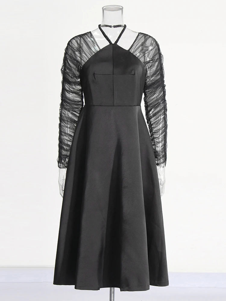 Modern club semiformal black dress with halter neckline