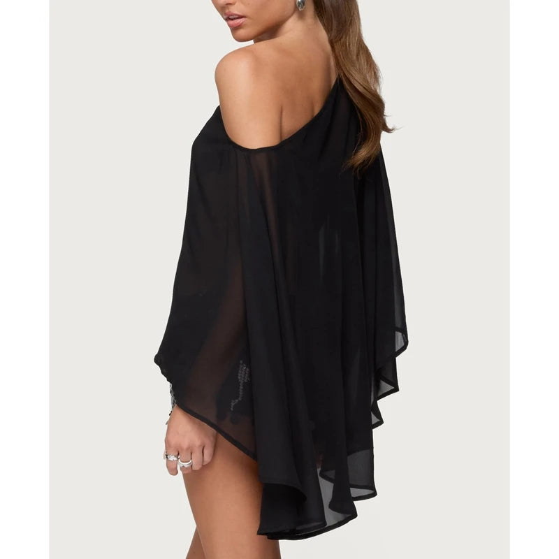 Modern sheer blouse with dramatic sleeves and loose fit