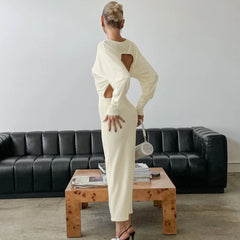 Modern open back white maxi gown with statement sleeves