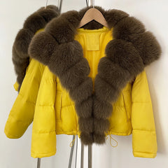 Close-up of the brown fox fur collar on a pink winter puffer jacket.