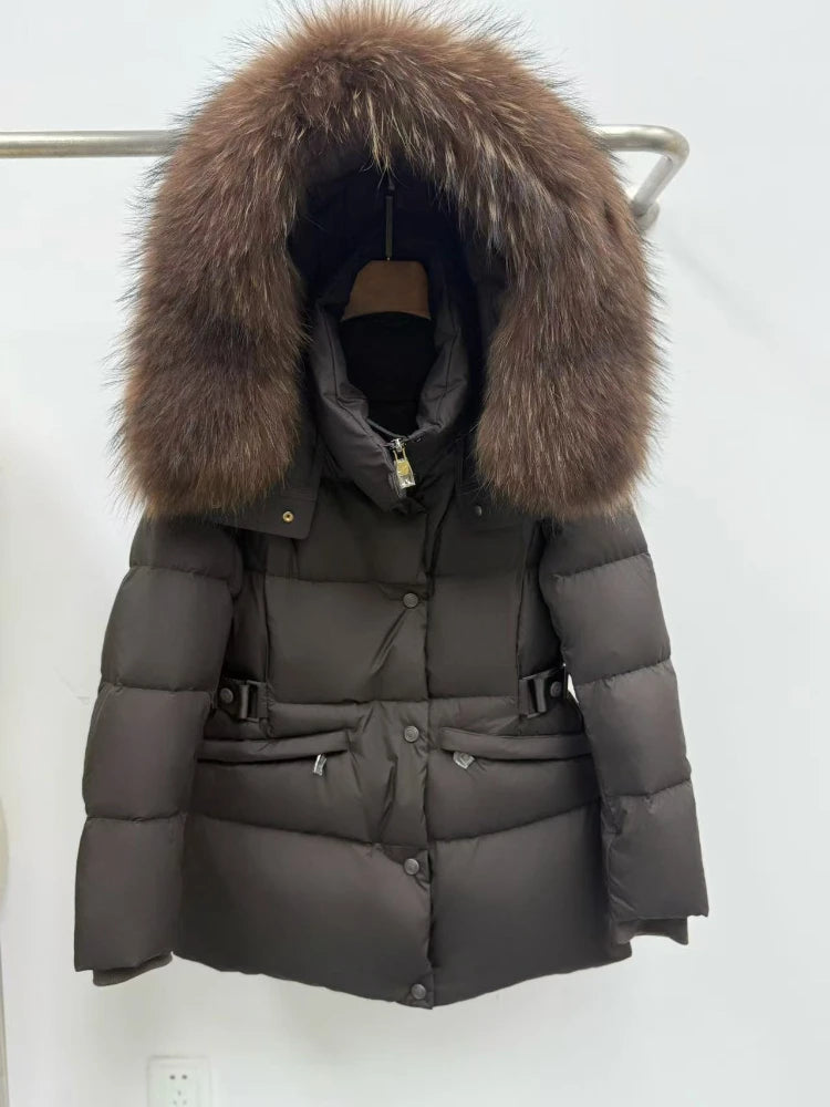 Close-up of the raccoon fur trim on a grey winter down jacket.