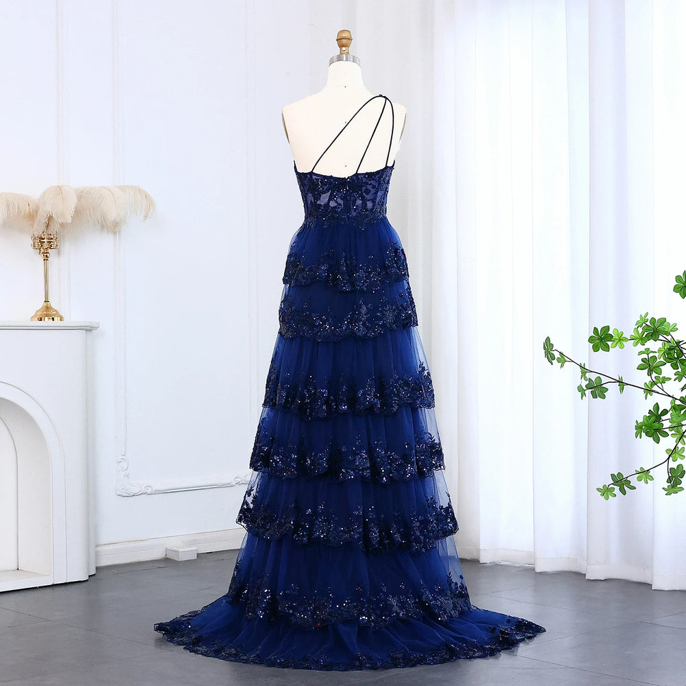 Close-up of the tiered skirt texture on an embellished formal gown