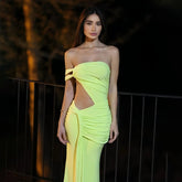 Neon yellow strapless maxi dress styled for nighttime events