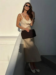 Side view of the two-tone satin dress showing its smooth A-line fall