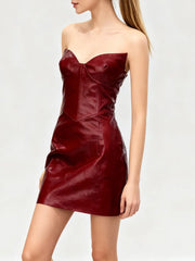 Shot of a sculpted faux-leather mini dress styled for night-out confidence.