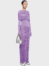 Full-length view of a pleated formal dress with slim silhouette on a plain background