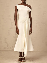 “Elegant A-line midi dress styled for spring office wear or evening look”