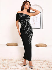 Off-shoulder cocktail dress with silver embellishments on black fabric