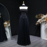 Off-shoulder evening gown displayed on a mannequin