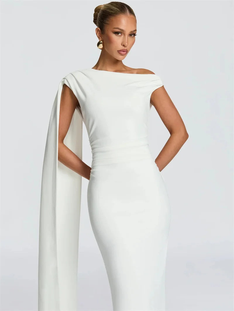 Close-up of the neckline and ruched bodice highlighting the dress’s refined, structured detailing.
