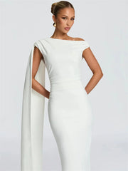 Close-up of the neckline and ruched bodice highlighting the dress’s refined, structured detailing.