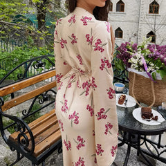 The full length of the satin dress, styled for a professional office look.