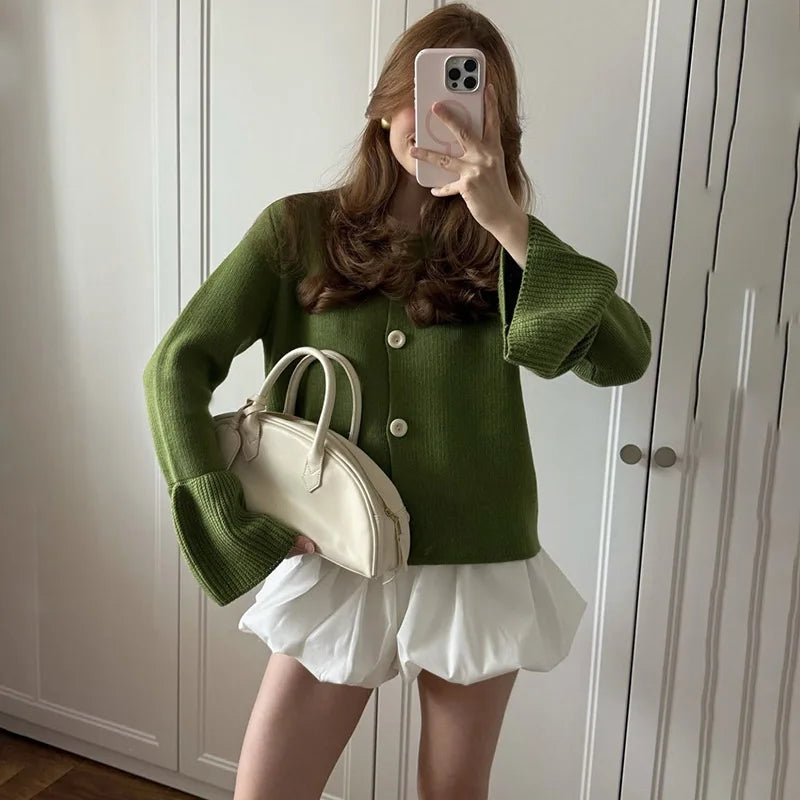 Olive green knit cardigan styled for modern autumn layering