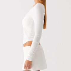 A close-up of the one diagonal shoulder collar detail on the top.