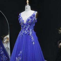 Floor-length A-line tulle gown with open-back detail and V neckline