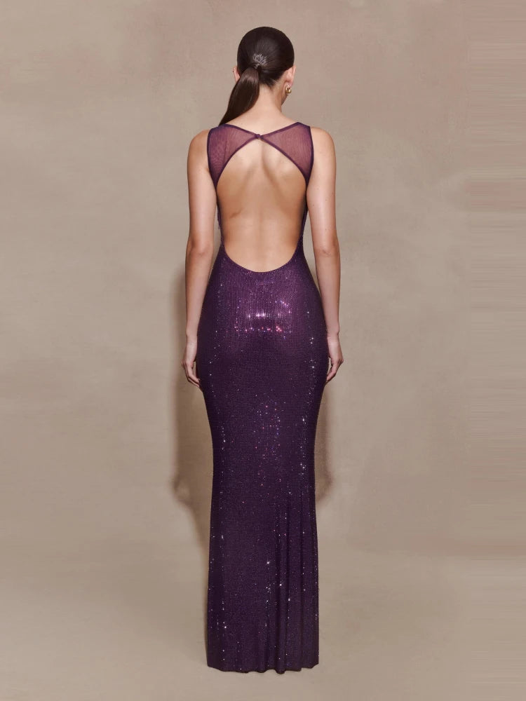 Open-back purple evening dress showcasing strap detailing