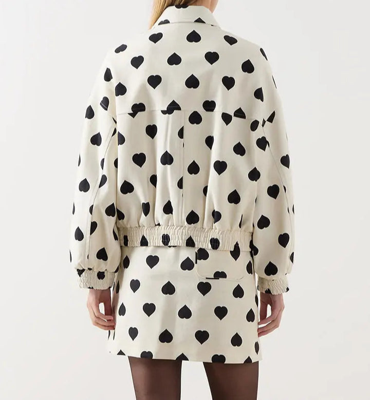 The full length of the short coat shows its regular and comfortable fit.