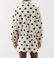 The full length of the short coat shows its regular and comfortable fit.