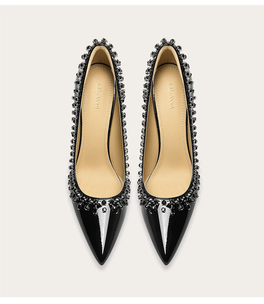 Patent leather pointed toe rhinestone pumps