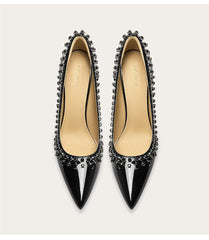 Patent leather pointed toe rhinestone pumps