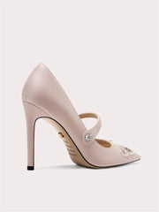 A close-up of the pearl and rhinestone detail on the shoe.