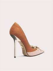 Close-up of suede pearl bow pointed toe stiletto shoes