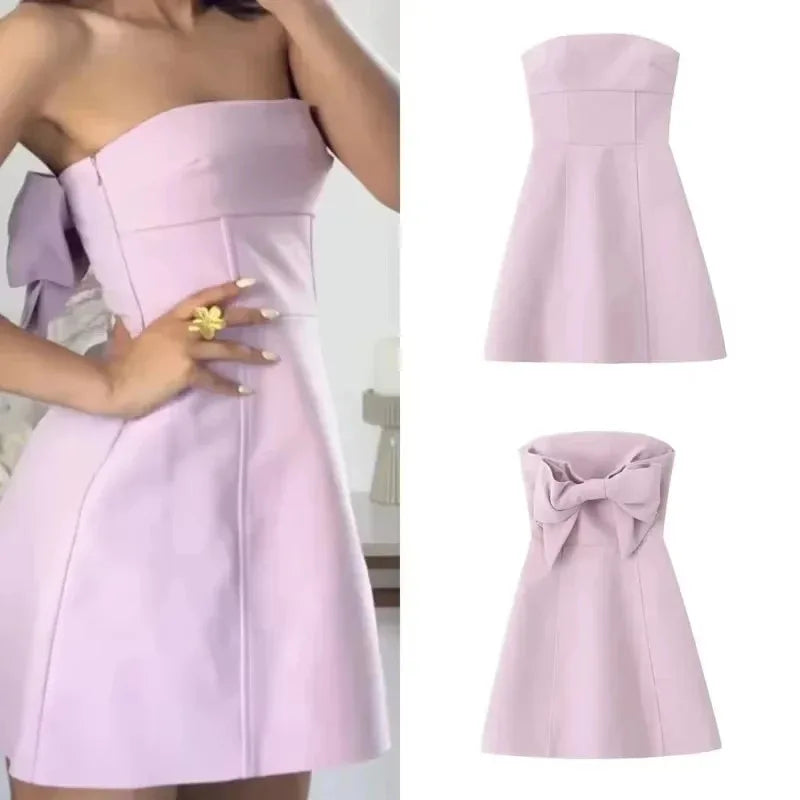 Pink bow strapless mini dress styled for chic summer parties