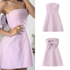 Pink bow strapless mini dress styled for chic summer parties