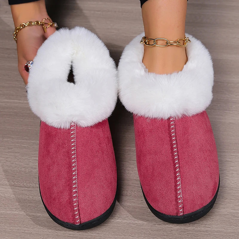 Pink faux suede slippers with white fluffy fur trim