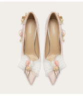 Pink floral butterfly knot pumps styled for spring weddings and garden parties