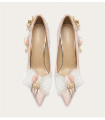Pink floral butterfly knot pumps styled for spring weddings and garden parties