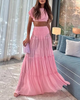 Pink floral crop top and maxi skirt set styled for spring picnics and vacation