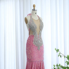 Close-up of illusion halter bodice with crystal detailing on sequin fabric