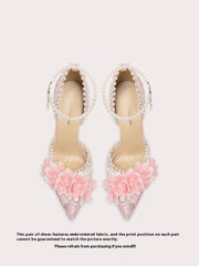 Pink floral bow heel shown in extended sizes for garden party dressing on a light background
