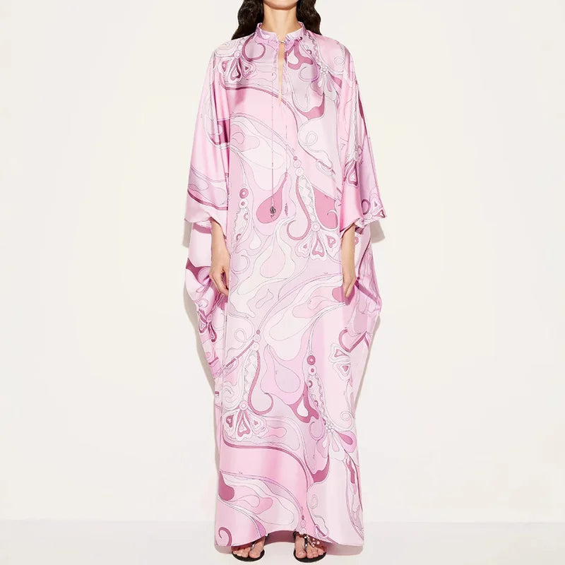 Pink pattern print maxi dress worn by model on white background