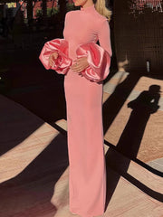 Pink maxi gown with dramatic puff sleeves styled for winter events