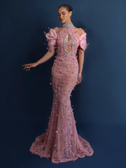 Pink sequin mermaid gown styled in a high-neck halter for gala elegance
